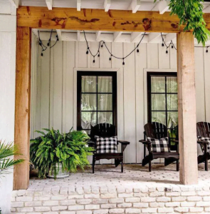White Board and Batten Style Siding shown on a homes front porch.