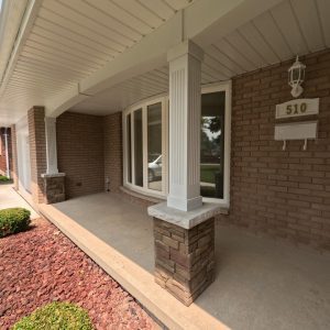 Panelized Stone Siding Added to the bottom of structure columns on a residential porch to provide visual appeal and texture.