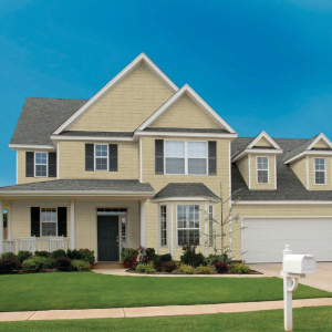 an image of a home with perfection shake shingle siding from kaycan in siding colour camel