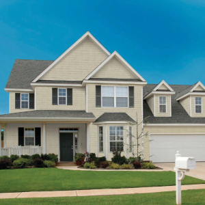 an image of a residential home with our perfection shake shingle from kaycan in siding colour canvas