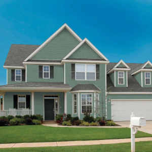 an image of a residential home with our perfection shake cedar look shingle siding from kaycan in siding colour evergreen.