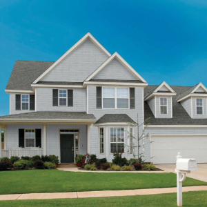 an image of a residential home with our perfection shake cedar look shingle siding from kaycan in siding colour heritage grey