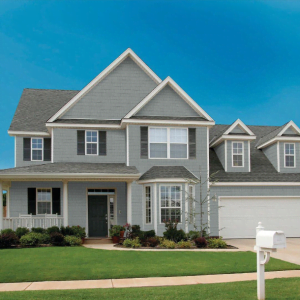 an image of a residential home with our perfection shake shingle cedar look siding from kaycan in siding colour charcoal