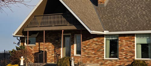 An image of a residential home showing the front porch before it had been renovated by Aurora Exteriors Inc.