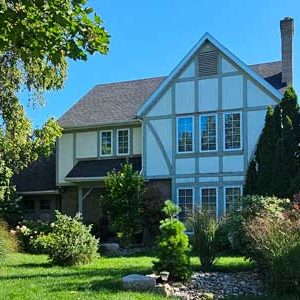 Tudor Style Home in Chatham Ontario Before Full Exterior Reface by Aurora Exteriors Inc