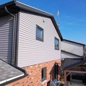 Back View of a Side Split Home with Stonecrest Vinyl Siding and Rustic Granite Trims