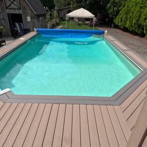 Trunorth Composite Above Ground Pool Deck with an Ash Grey Board and Sand Coloured Filler.
