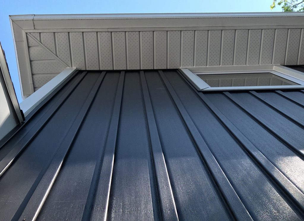 Dark Vertical Vinyl Siding on a Residential Home in Chatham-Kent