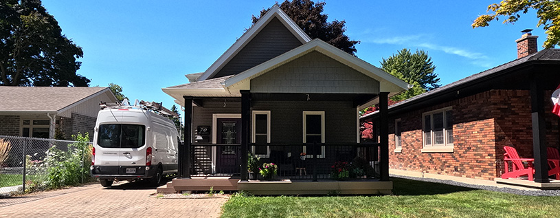 Front of House Renovated to include a Covered Porch Addition and Siding by Aurora Exteriors Inc.