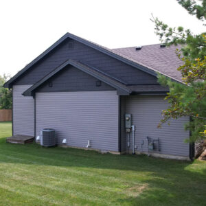 Left side manor gable accents and stonecrest grey vinyl siding.