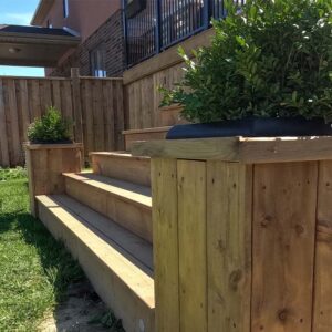 Built In Planters Added to the Stair Corners of a Multi-tier Deck Built By Aurora Exteriors Inc.